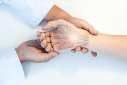 The orthopedic doctor or surgeon in uniform examined the patient with numbness of hand.Wrist pain in carpal tunnel syndrome with transparent anatomy of median nerve.Light effect on white background.