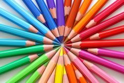 Macro of colored pencils in a circle.