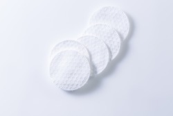Cotton pads with a shadow on white. Copy space for your text.