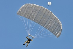 Skydiving -extreme sports- parachutist with a parachute unfolded.