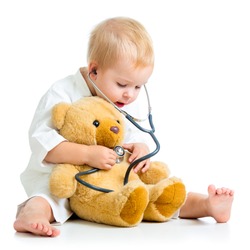 kid playing a doctor isolated on white