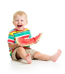 child boy eating watermelon isolated on white