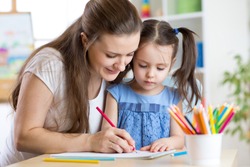 mother and her child pencil together