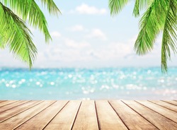 Wooden table top on blue sea and white sand beach background. Coconut palm trees against blue sky and beautiful beach in Punta Cana, Dominican Republic. Vacation holidays background wallpaper. 