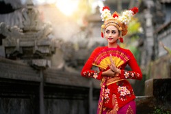 Indonesian girl with traditional costumn dance in bali temple, indonesia