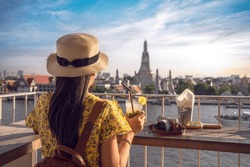 Wat arun pagoda with sunset background in Bangkok city of Thailand, Take a picture from a roof top of hotel near the chao phraya river, The best travel destination for travel in Bangkok and Thailand