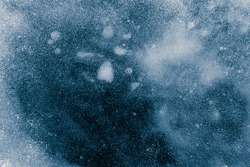 Ice texture background. Textured cold frosty surface of ice on dark background.