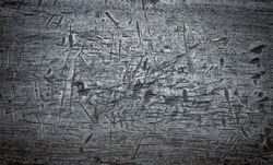 The rough texture of the black metal. Metal detailed backdrop. Grunge steel scratched background texture.