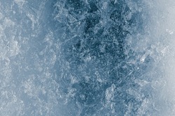 Ice texture background. The textured rough crushed cold frosty surface of the ice block background.
