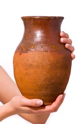 Old jug in woman hand on white background