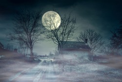 Spooky scene of haunted house and moon