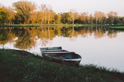 Boat on autumn lake 