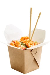Opened WOK paper box of salad with shrimps and chopsticks. Asian fast food concept.