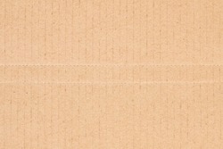 Flat brown cardboard background texture with perforated lines that will help the box fold texture background