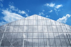 Greenhouse Against reflective light  Blue Sky 