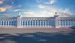 White decorative fence made of concrete with columns on the seashore