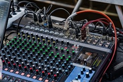 Sound audio mixer. General plan of sliders and buttons on a mixing console with connected audio jacks
