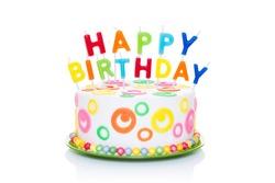 happy birthday cake or tart with happy birthday letters as candles very colourful and looking very tasty, isolated on white background