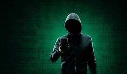 Hacker over Abstract Digital Background with Elements of Binary Code and Computer Programs. Concept of Data thief, internet fraud, darknet and cyber security.