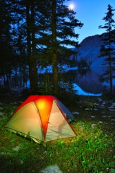 Night camping in a tent on the lake in Snowy Range Mountains in Medicine Bow, Wyoming