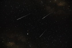 The three shooting stars in dark night with stardust.