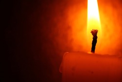 Close up of Candle with red background