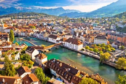 City of Luzern riverfront and rooftops aerial view, Alps landscape of Switzerland