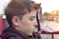 portrait of a teenage boy in profile