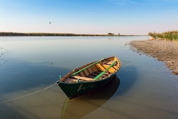 Wooden boat and calm river horizontal view