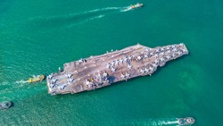 Top View Aircraft Carrier are sailing in the ocean
