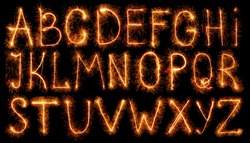 Alphabet made of sparklers isolated on black background