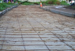 Mesh made of metal reinforcement prepared for concrete pavement road in rural ,Thailand