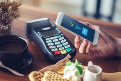 Hand and mobile payment in coffee shop ,mobile payment concept