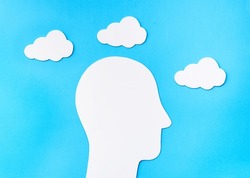 Relax and Meditate concept. Paper cut Head Silhouette with Clouds
