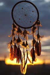 Dream-catcher with sunset on the background