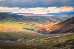 View looking down Upper Coquetdale, a remote valley located in the Cheviot Hills close to the Scottish Border in Northumberland National Park