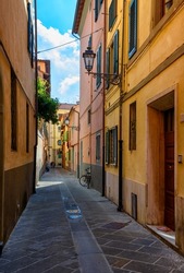 Narrow cozy street in Pisa, Tuscany, Italy. Architecture and landmark of Pisa. Cityscape of Pisa