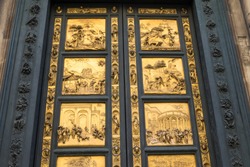 Gates of Paradise with Bible stories on door of Duomo Baptistry in Florence, Italy.  Architecture and landmarks of Florence