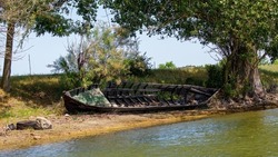 Old damaged boat in the Danube Delta