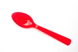 a red spoon made of plastic