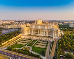 Parliament building or People's House in Bucharest city. Aerial view at sunset