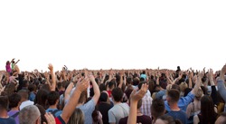 many happy people with raised hands at a concert or show