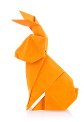 Easter bunny of orange origami. Isolated on white background