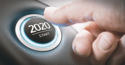 Finger about to press a car ignition button with the text 2020 start. Year two thousand and twenty concept.