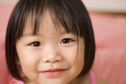 little asian girl with smiling face