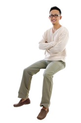 Full body Asian man sitting on a transparent block over white background