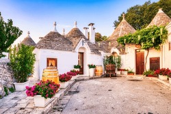Famous Trulli Houses during a Sunny Day with Bright Blue Sky in Alberobello, Puglia, Italy
