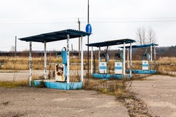 rusty abandoned pump on the gas station at autumn day in Russia