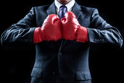 Businessman , boxing gloves , fighting pose