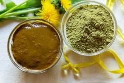 Henna powder. Henna paste. Prepare the henna paste at home. Still life with henna and dandelions. Focus on the powder.